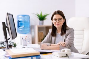 Attractive office manager at desk