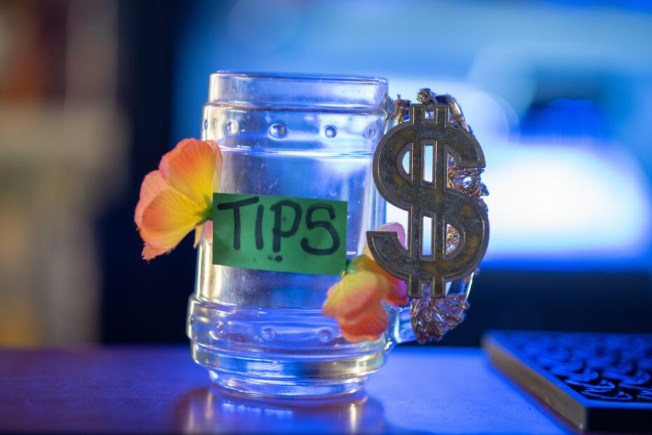 Empty tips jar on table at bar